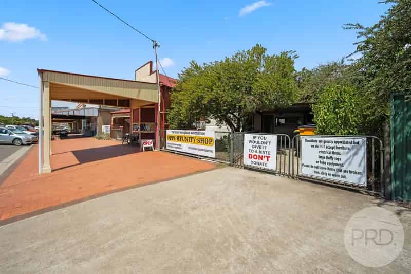 Charming 3-Bedroom Brick Home with Spacious Shop & Sheds!