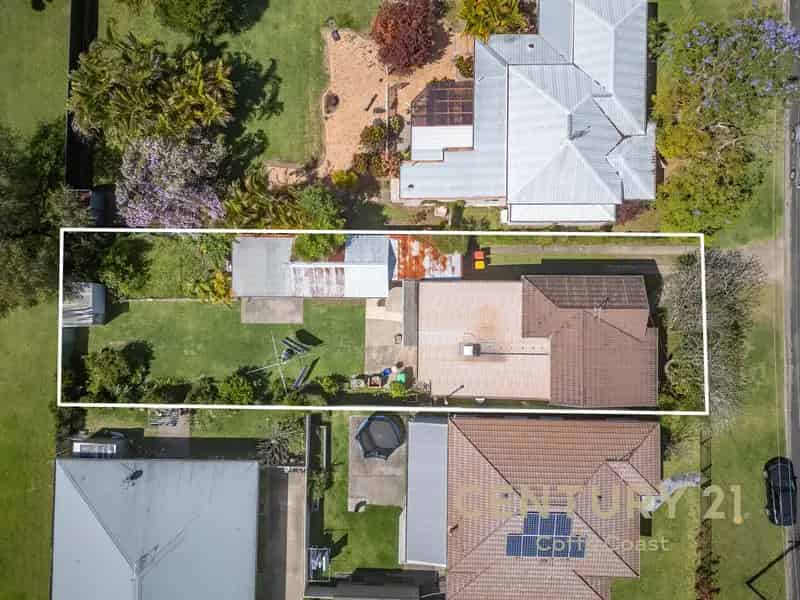 House for Sale in Coffs Harbour with Renovation Potential and Spacious Yard