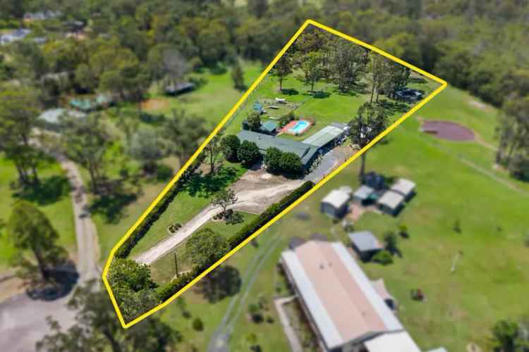 Family Fun in Jilliby on 2.5 Acres with a Lovely Country Homestead, Pool, 3 Paddocks and Lots of Storage.