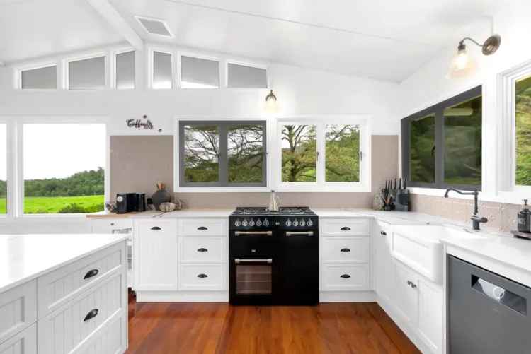 A Stunningly Picturesque Queenslander Meets Sophisticated Farmhouse Cottage on 30.44ha with Sprawling Views!