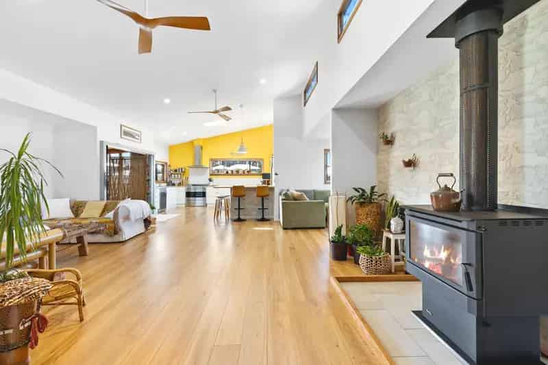 Contemporary buy house in Narrawallee with multiple living spaces and views