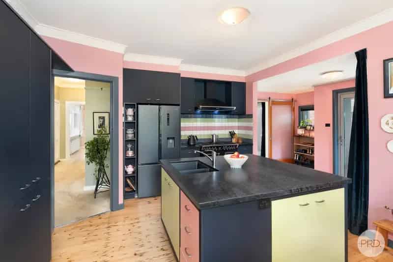 Elevated Mid-Century Home with Separate Studio on Large 2060m2 Block