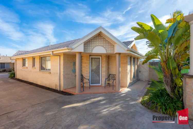 Buy Beachside Villa with Spacious Outdoor Area and Double Garage