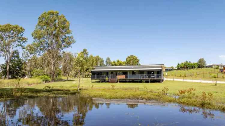 Designer Home On Acreage Property With Town Water