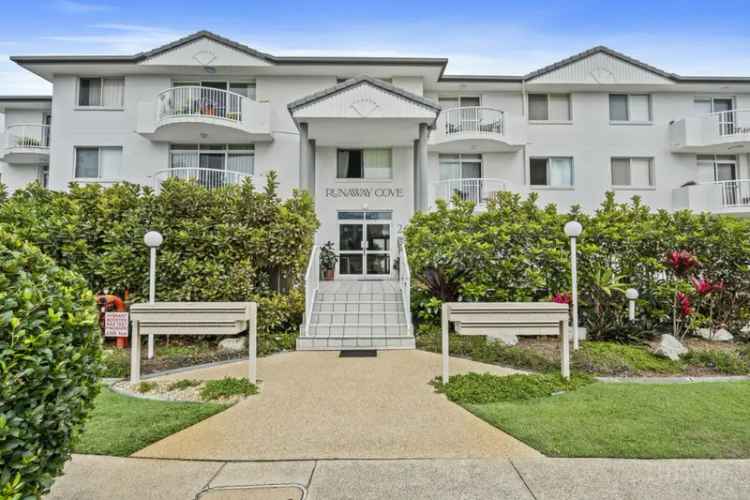 Buy spacious top floor unit in Biggera Waters with pool views and features