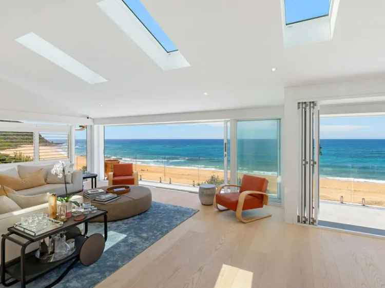 Beachfront buy property retreat with ocean views and private gardens