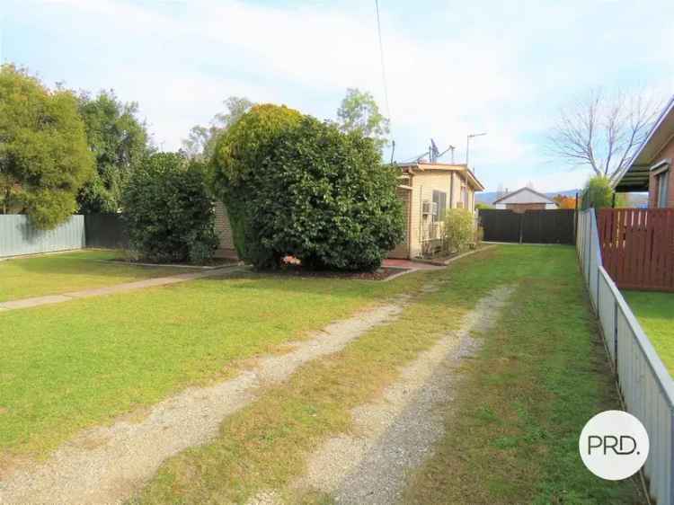 Neat Two Bedroom Home with Large Yard and Shed