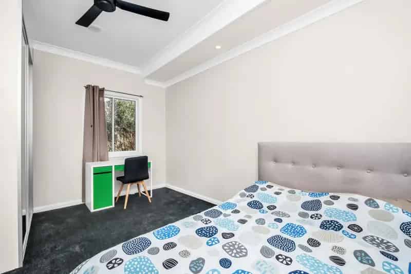 Buy Home in Point Clare with Water Glimpses and Spacious Garden
