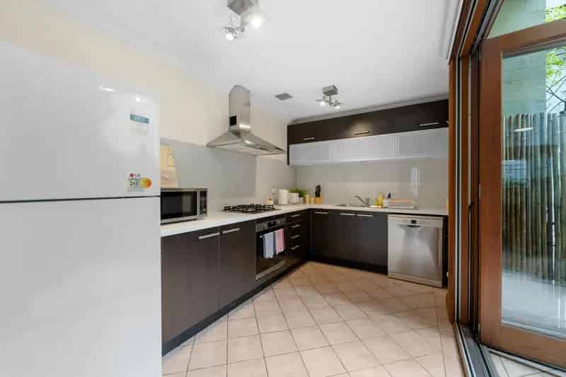 Buy Tri Level Townhouse in Ultimo with Outdoor Space and Garage