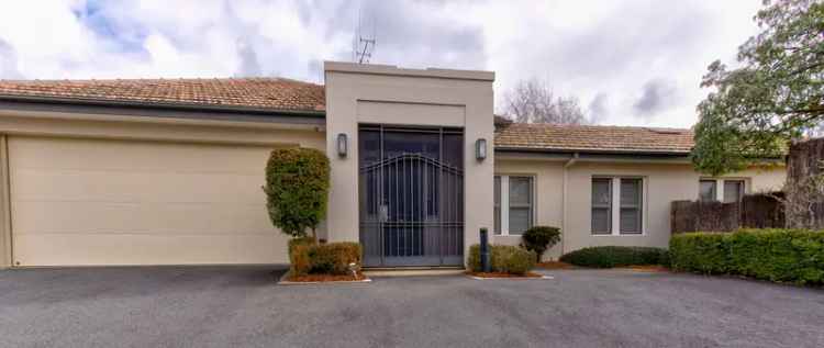 Rent fabulous single level townhouse in secure complex with gardens