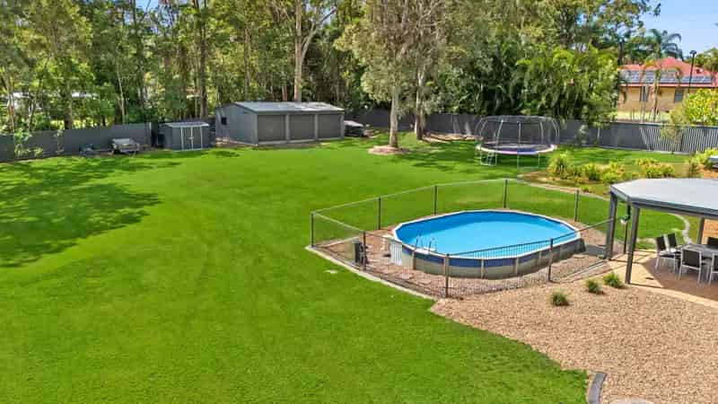 A Queenslander's All Season Family Paradise | Pool | 2 Sheds | Solar + Fireplace + Office
