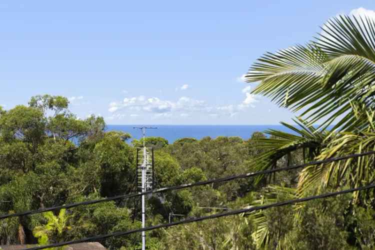 Buy substantial family home with ocean views in a leafy pocket