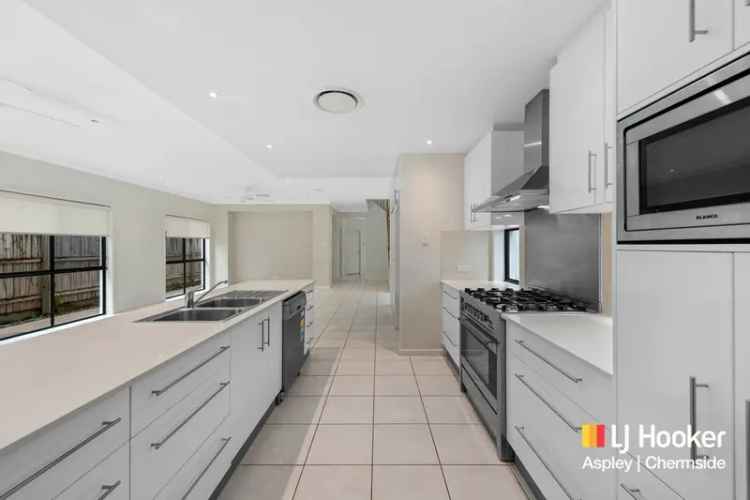 Buy house in Wavell Heights with 4 bedrooms and modern features