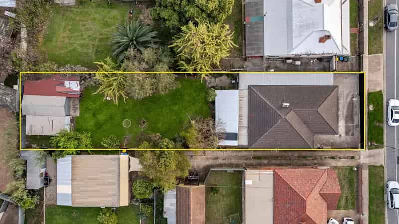 Buy Solid Brick Home in Prime Location with Expansive Backyard