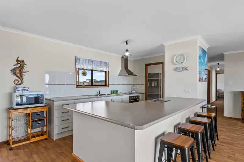 Buy Coastal Family Home in Tickera with Spacious Living Areas and Deck